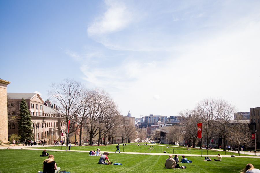 hilltop view of Madison with students studying