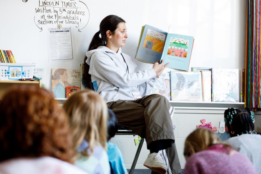 a teacher reading to kids